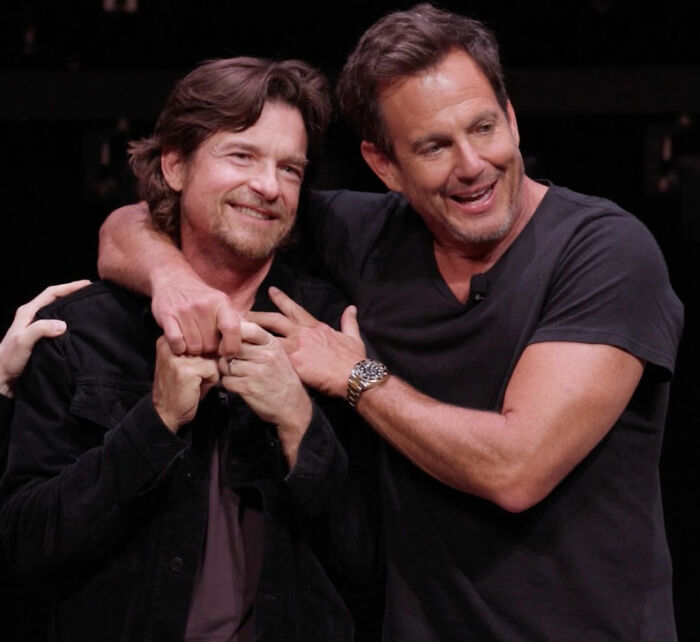 Will Arnett with Jason Bateman, smiling and embracing, addressing the invasive question about Amy Poehler. Will Arnett with Jason Bateman, smiling and embracing, addressing the invasive question about Amy Poehler.
