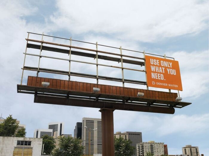 Creative billboard design promoting water conservation with a minimal sign on an empty frame