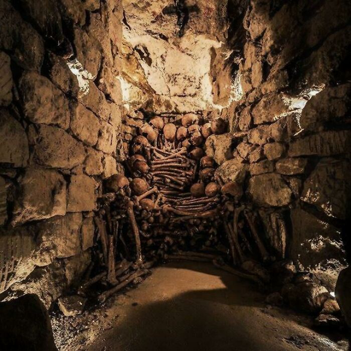 Long empty tunnel with curved white walls in urban exploration forgotten place