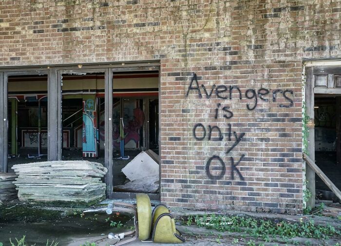 Graffiti on brick wall in abandoned urban exploration building