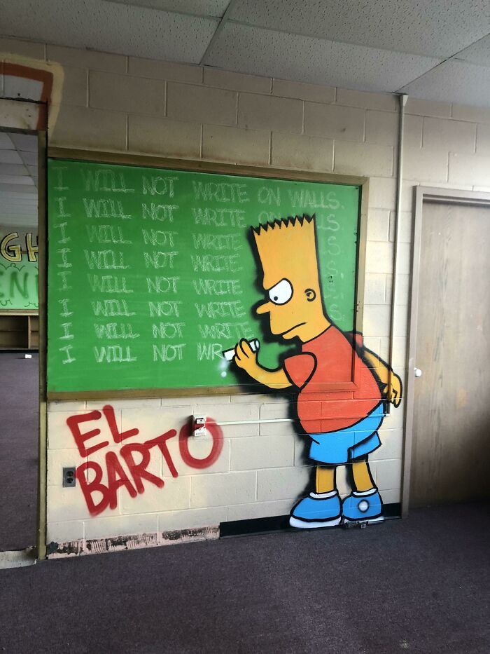 Graffiti of Bart Simpson writing on wall in abandoned building urban exploration
