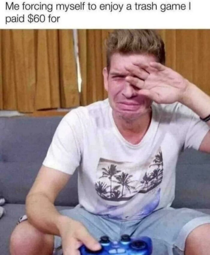 Man crying while playing game he paid 60 dollars for, representing frustration with trash games