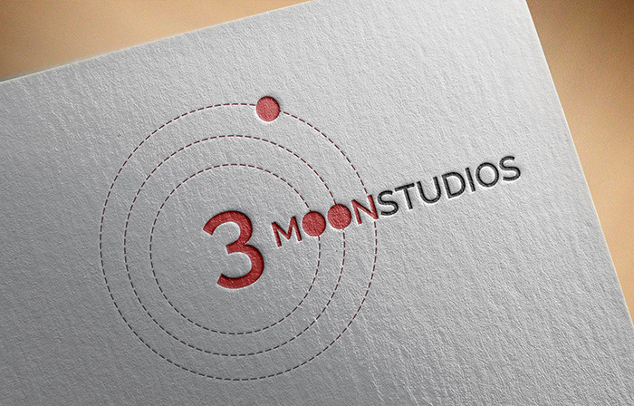Logo design for 3 Moon Studios with orbiting moon graphics