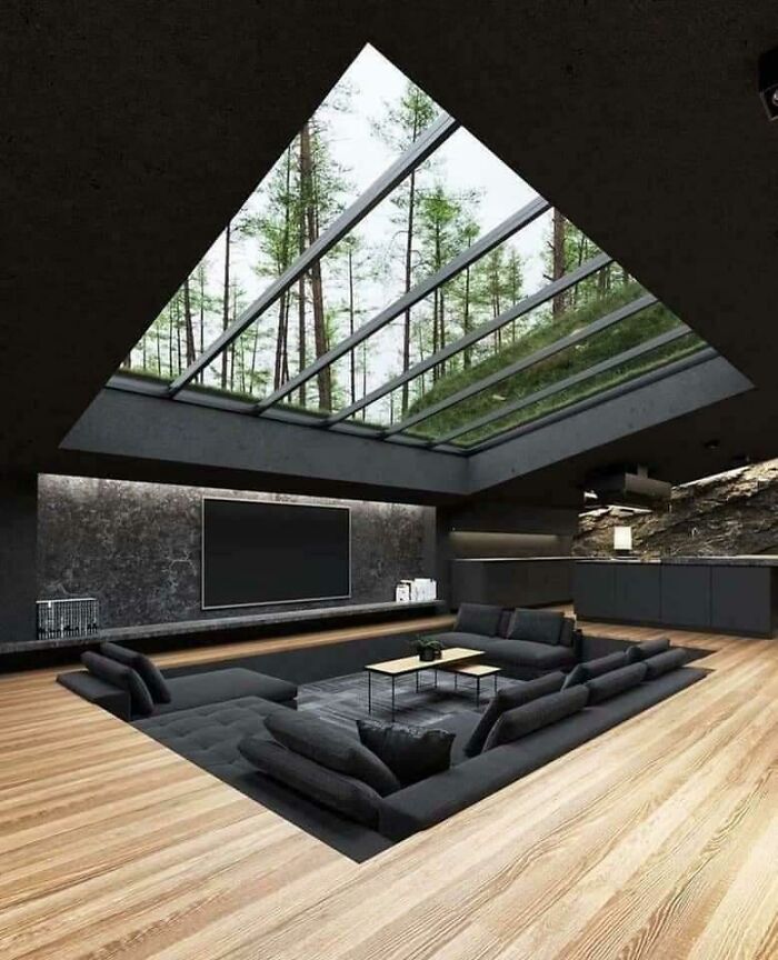 Creative designers made sunken living room with glass ceiling