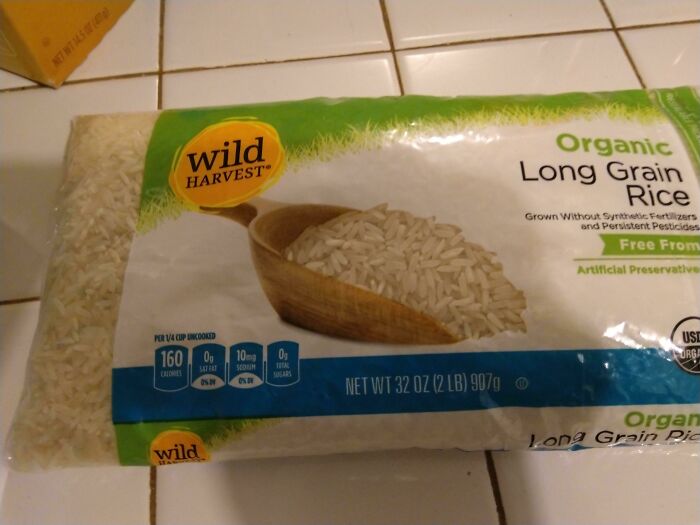 Organic long grain rice package from Wild Harvest on kitchen counter