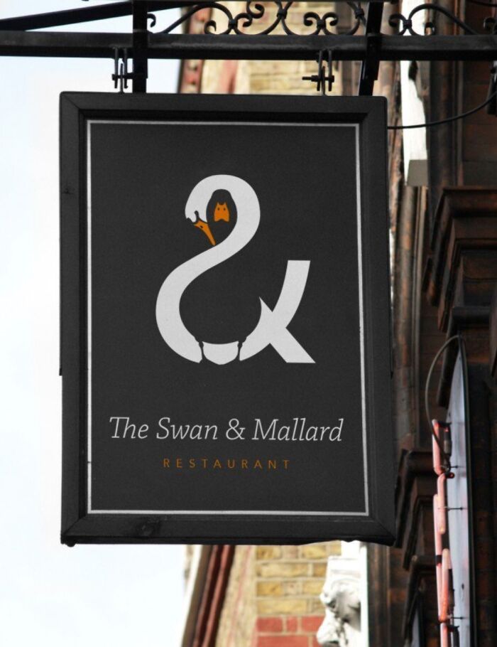 Creative restaurant sign with swan and mallard logo design