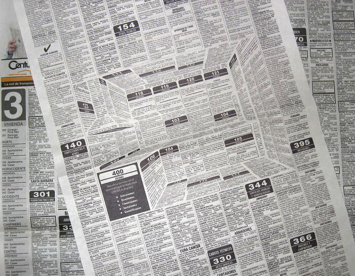Newspaper creatively folded to create optical illusion of depth