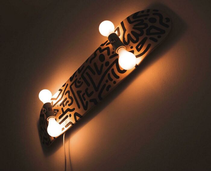 Skateboard deck with light bulbs creatively designed as wall lamp