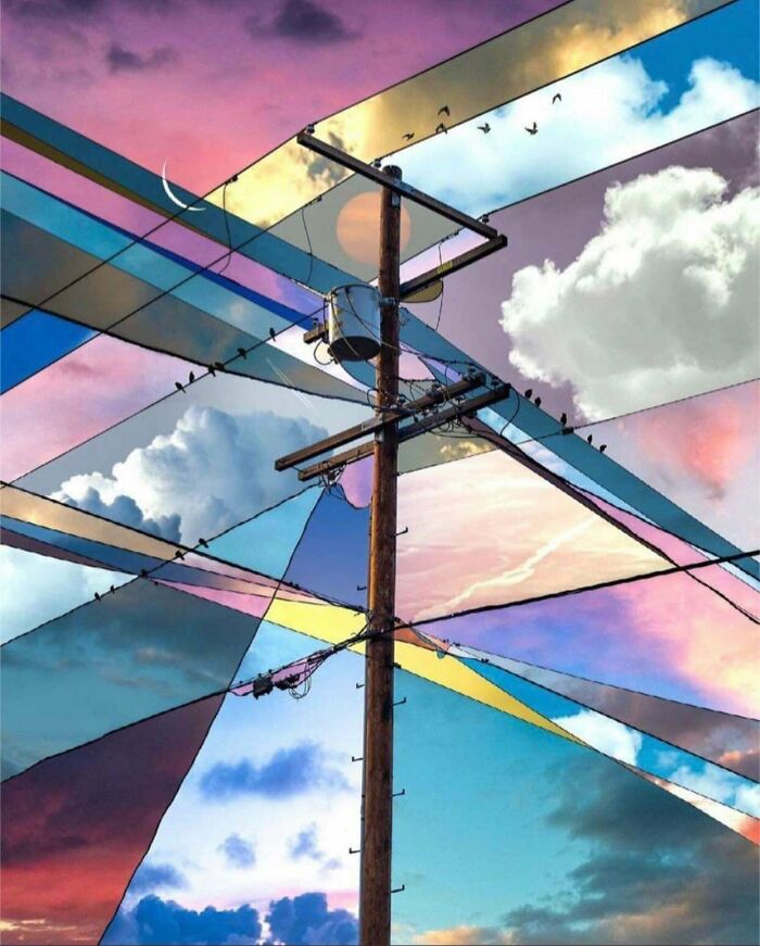 Artistic creative installation with power pole and colorful sky reflections