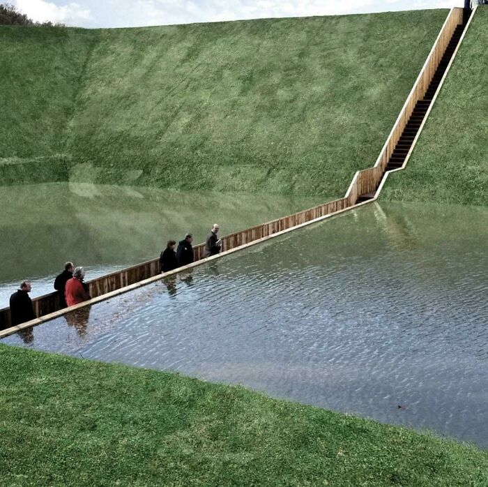 Genius landscape design with stairs creating pathway over water