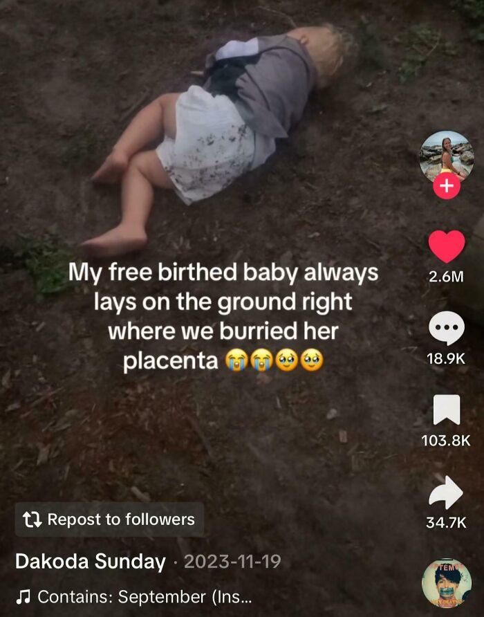 Free birthed baby lying on ground near buried placenta