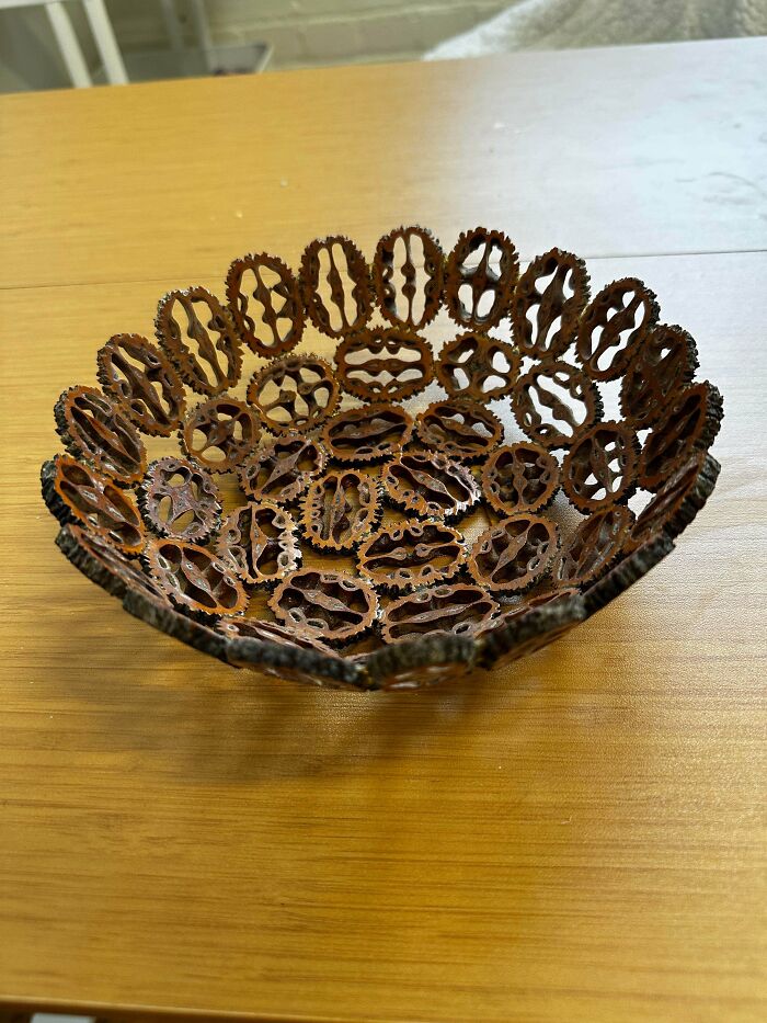 Bizarre Goodwill find wooden decorative bowl on a wooden table