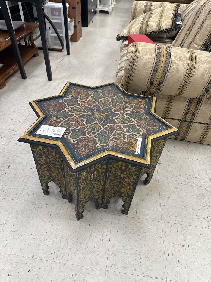 Intricately carved star-shaped table found at Goodwill thrift store