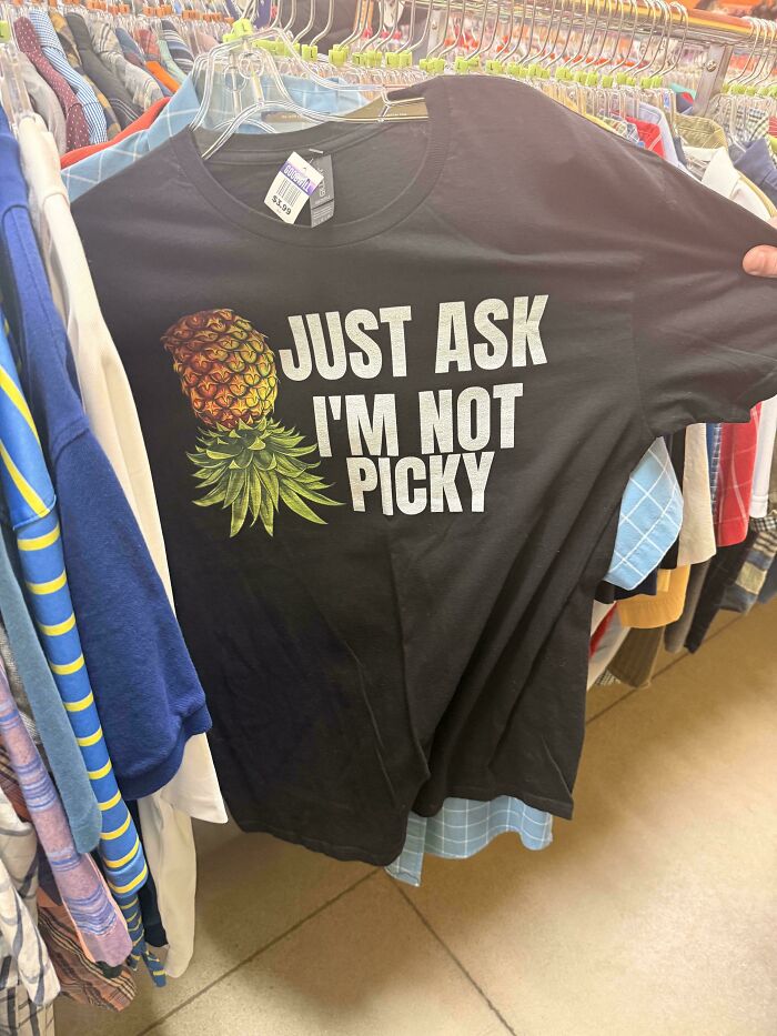 Funny thrifted black T-shirt with pineapple and phrase not picky at Goodwill store