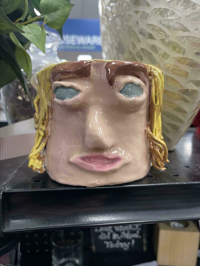 Quirky handmade ceramic face mug thrifted from goodwill shelf