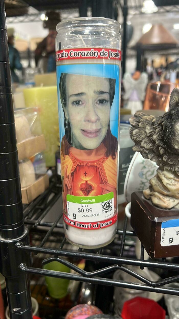 Goodwill candle with unusual photo montage of woman's face on Jesus image