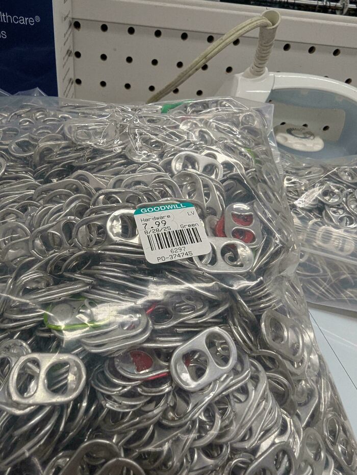 Bag of metal pop can tabs for sale at goodwill hardware section