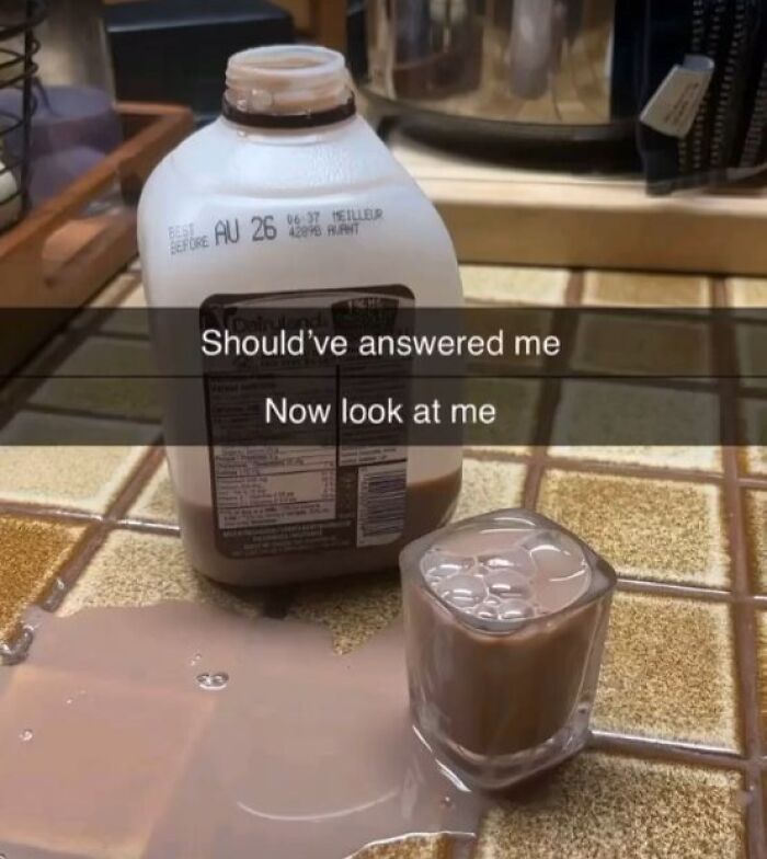 Spilled chocolate milk with caption about not answering message