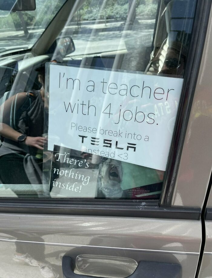 Sign on car window from a teacher with four jobs asking for Tesla job