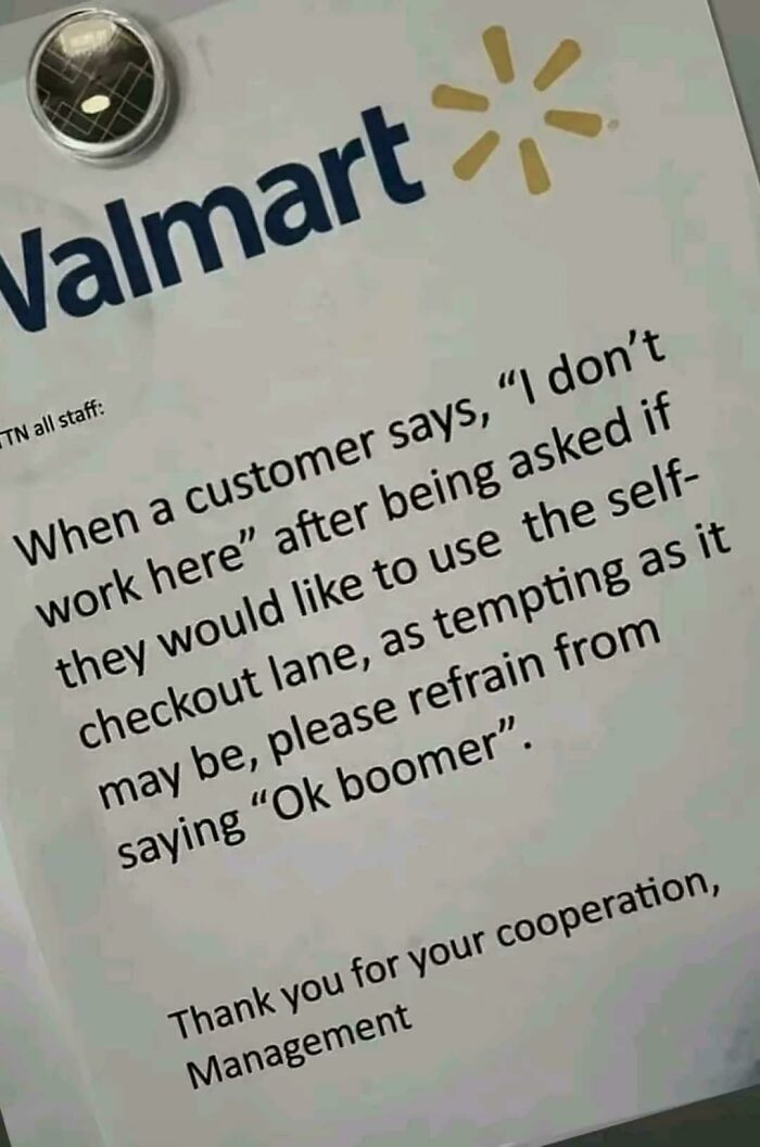 Walmart sign with management note about customer self-checkout lane