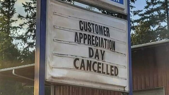 Store sign showing customer appreciation day cancelled outside business