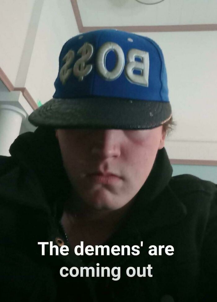 Person wearing boss cap with serious face and caption the demens are coming out