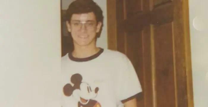 Young man wearing Mickey Mouse shirt for horror movie story