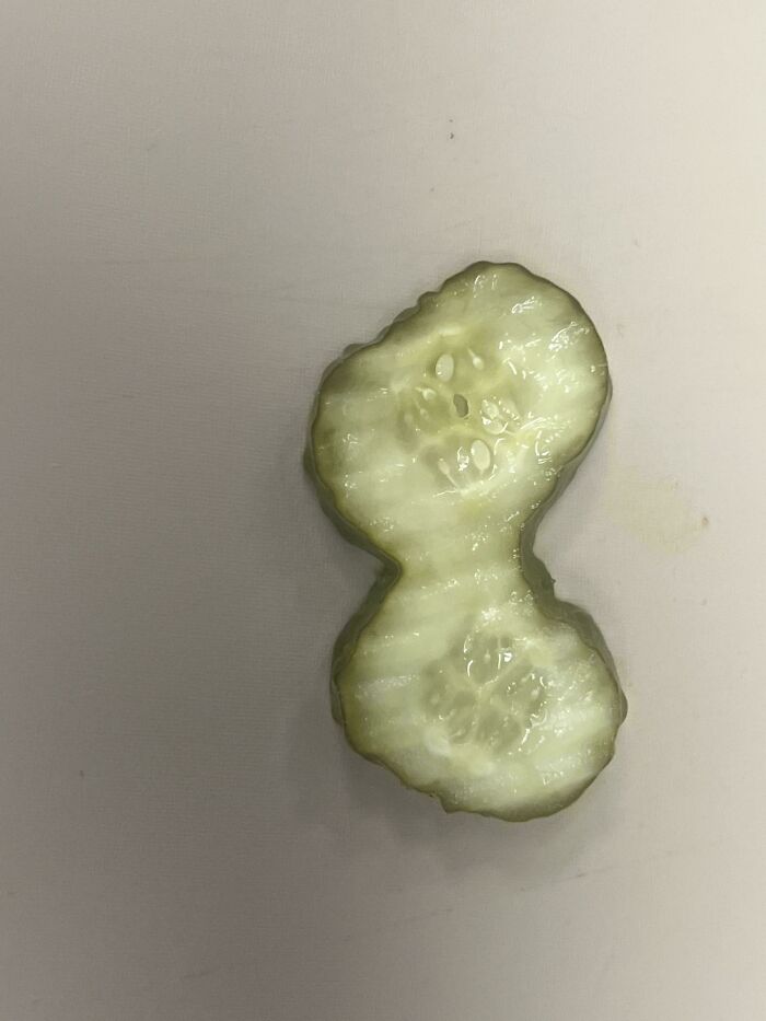Oddly shaped cucumber slice with a freaky natural form