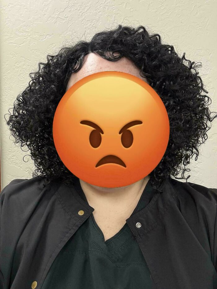 Person with curly hair and angry emoji face representing workplace frustration