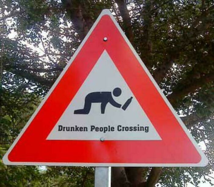 Funny warning sign for drunken people crossing
