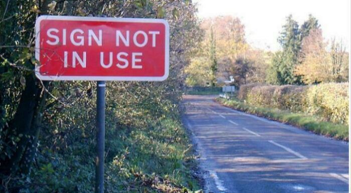 Ironical road sign stating sign not in use