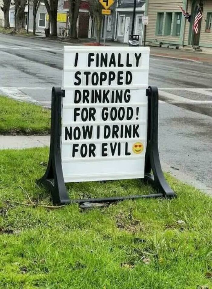 Funny sign about drinking for evil spotted outdoors