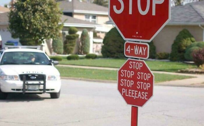 Stop sign with extra small sign pleading stop repeatedly