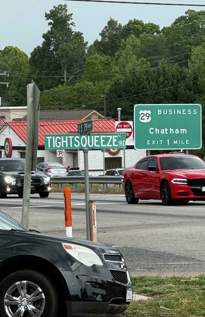 Street sign for TightSqueeze Road with Chatham business exit sign