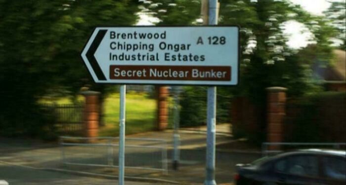 Humorous road sign pointing to secret nuclear bunker