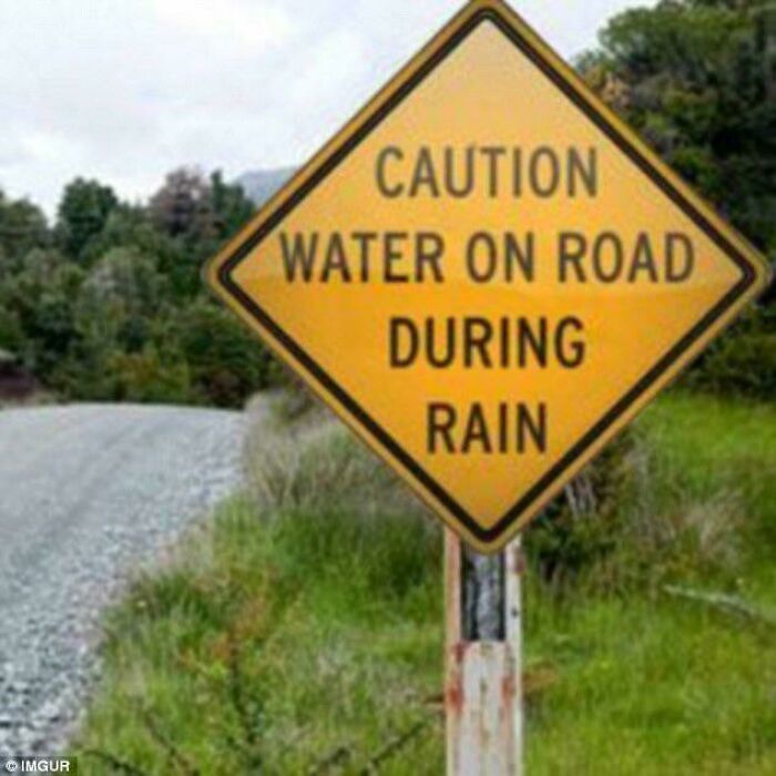 Funny warning sign cautioning water on road during rain