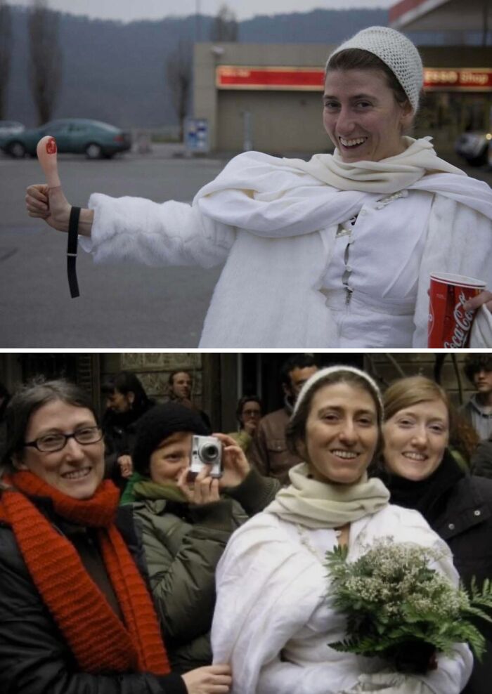 Woman dressed in white smiling and giving thumbs up outdoors