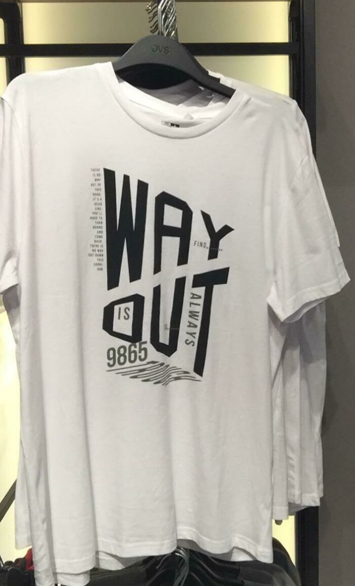 A white t-shirt with abstract black text that reads 'WAY IS OUT ALWAYS' with numbers, a questionable clothing design.