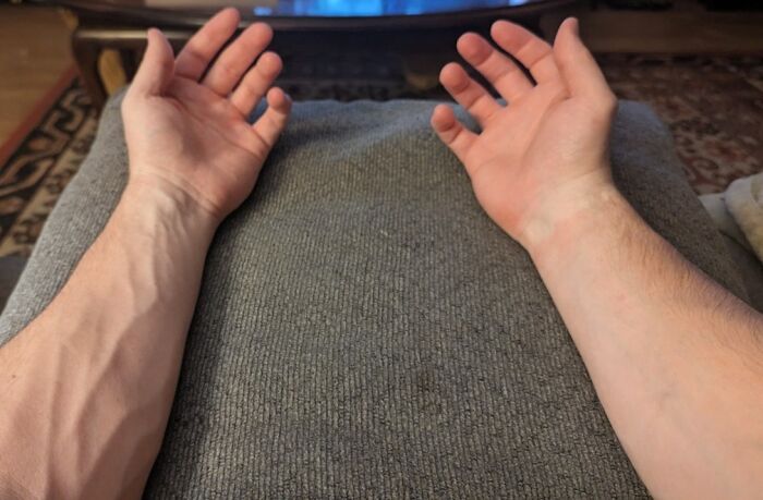 Veins prominently visible on forearms showing human body quirks