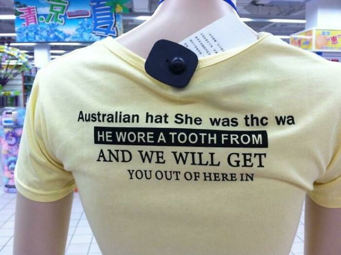 Yellow t-shirt on a mannequin with grammatically incorrect and nonsensical English text, featuring bad clothing designs.
