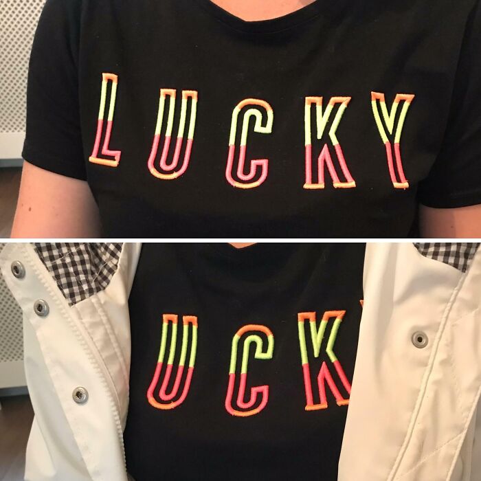 A black T-shirt with the word LUCKY, partially covered by a white jacket, turning it into UCK, an example of bad clothing design.