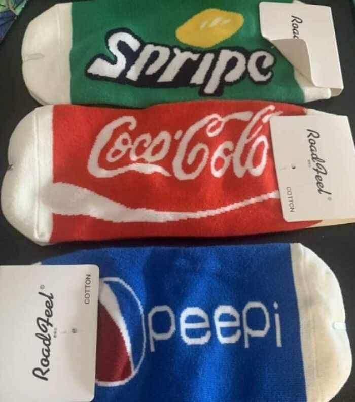 Three pairs of socks with misspelled soda brands: Spripe, Coca-Cola, and Peepi, an example of bad clothing designs.