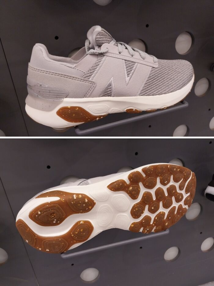Side and sole view of a grey sneaker, showcasing an unusual texture on the sole, a poor clothing design choice.