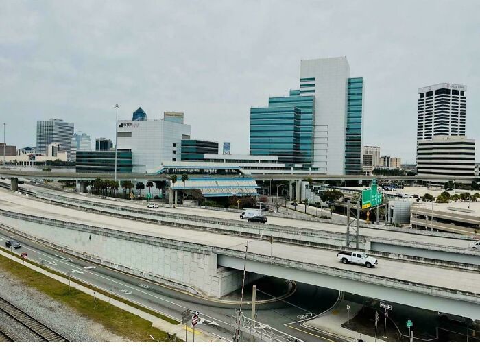 Modern city skyline with highways and office buildings in urban setting