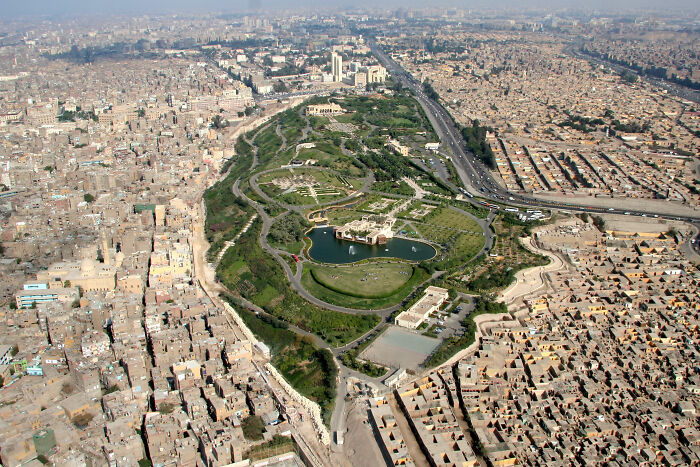 Aerial view of densely packed urban area with small park in center