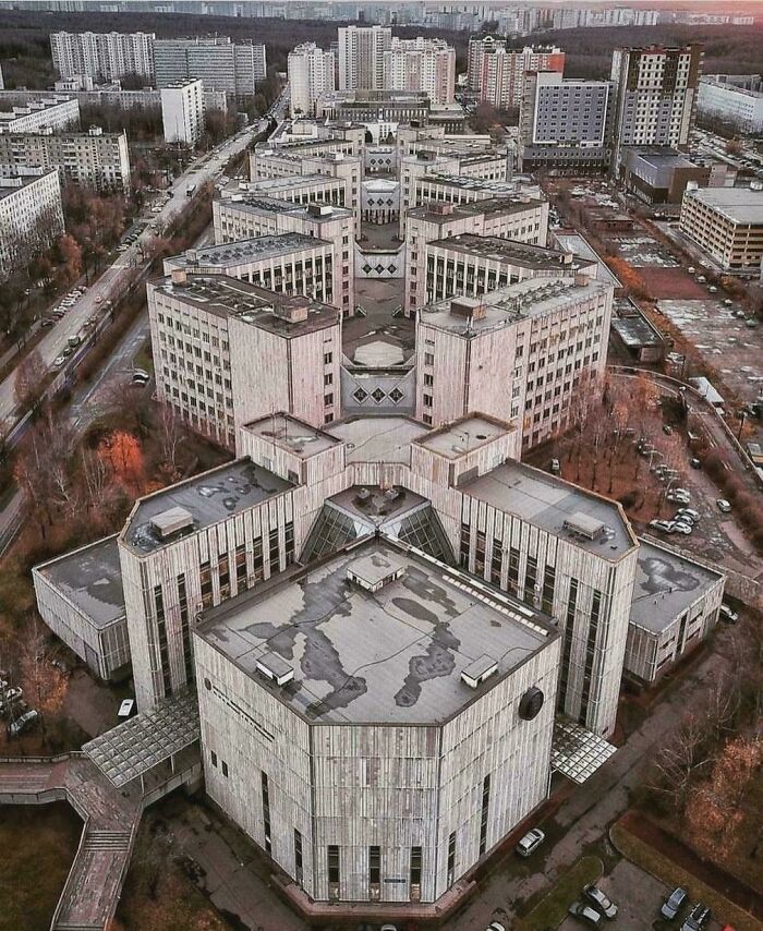 Massive concrete brutalist building complex in an urban setting