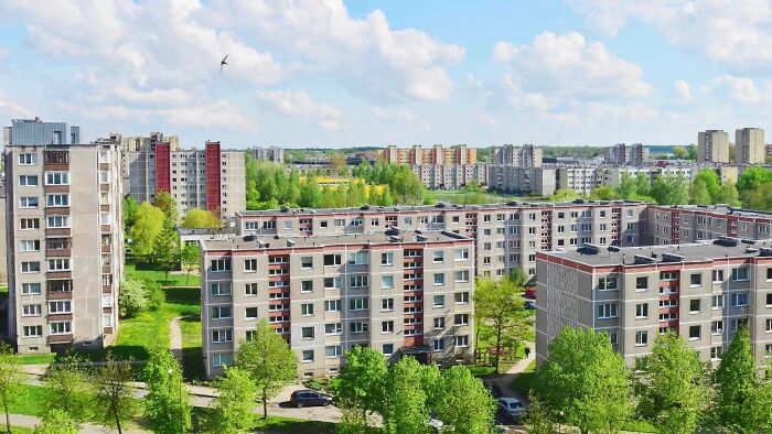 Dense apartment blocks surrounded by greenery showing urban hell housing