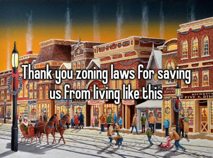 Holiday decorated suburban street with text thanking zoning laws