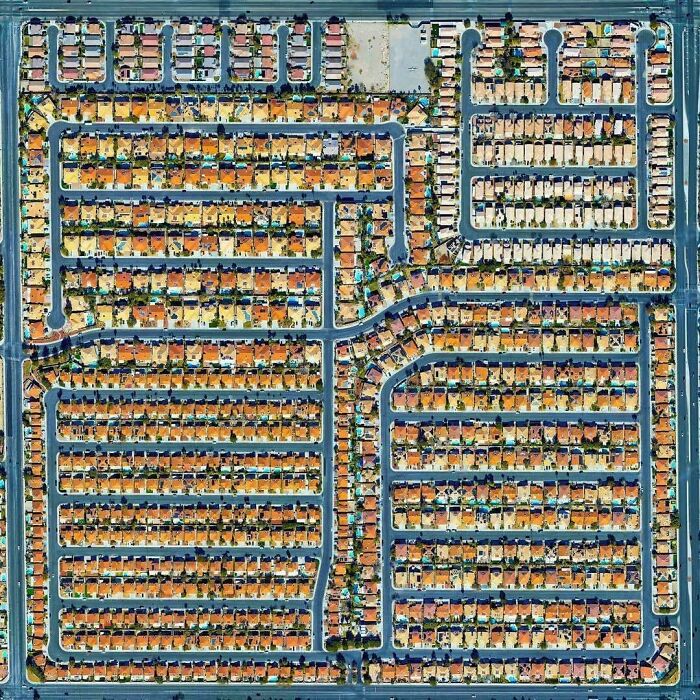 Aerial view of tightly packed suburban houses in planned neighborhood
