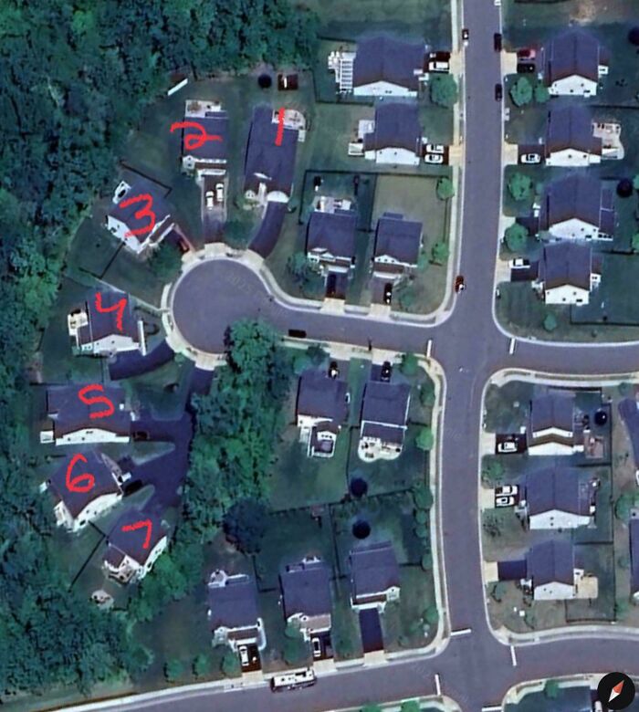 Aerial view of suburban cul-de-sac with houses numbered